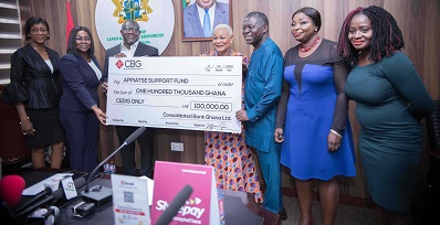 Mr Addo (third from left) presenting a dummy cheque to Rev Dr Aryee (fourth right) while other officials of both institutions look on