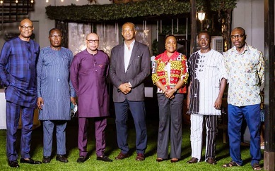 Mr Awotwi (fourth from right) with Mr Balogun and other board members of UBA Bank Ghana Plc