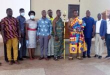 Mr Seth Amponsah (middle), Nana Amponsah Takra II (sixth right) and Mr George Oppong Dankwa, Bono East Regional Director, NHIA (fifth right) and other dignitaries after the meeting