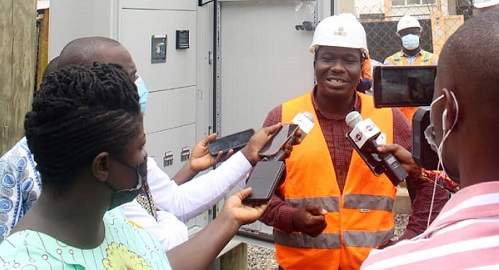 Mr Roland Osei briefing the media during the tour