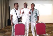 Takyi flanked by the Quarteys - Ike (right) and Clement