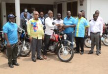 DSC 0336: Mr Odotei (fifth from right) presenting the motorcycles to Mr Sabutey. With them are Mr Theo Mensah, Project Manager, Mr Adotei Brown, Past District 9102 President, Mr Jonas Ayikwei President of District 9102 and representatives of the other assemblies.