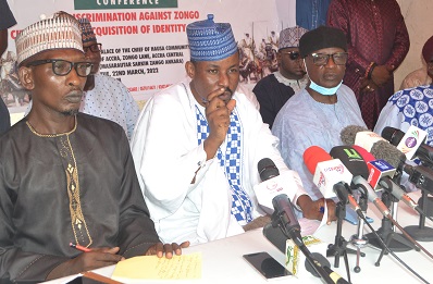 Mr Haruna Maiga (second from left) speaking at the programme . With him is Alhaji Ali Kadir English ( right) and other dignitaries Photo Victor A. Buxton