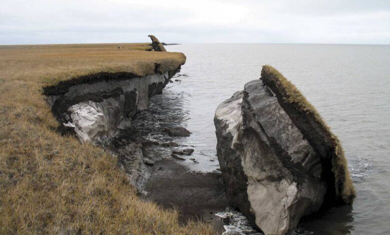 Thawing permafrost can result in the loss of terrain, as seen in this image where part of the coastal bluff along Drew Point, Alaska, has collapsed into the ocean. Credits: Benjamin Jones, USGS