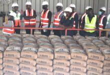 Nana Philip Archer(left),MD,Dzata Cement briefing Mr Asenso Boakye(second from left) and his team at the factory. Photo Godwin Ofosu-Acheampong