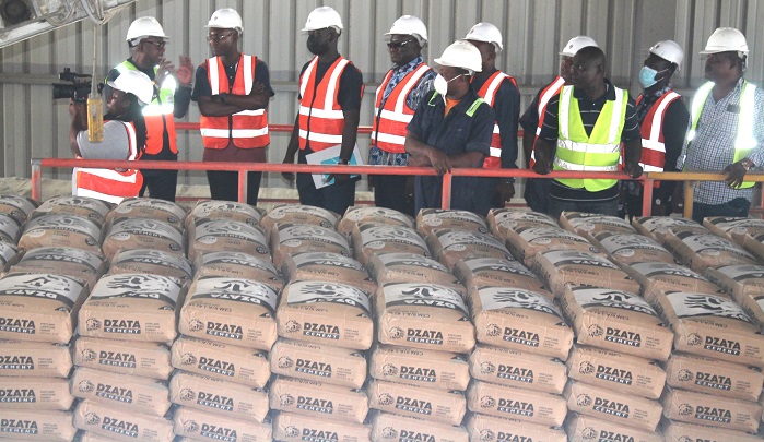 Nana Philip Archer(left),MD,Dzata Cement briefing Mr Asenso Boakye(second from left) and his team at the factory. Photo Godwin Ofosu-Acheampong