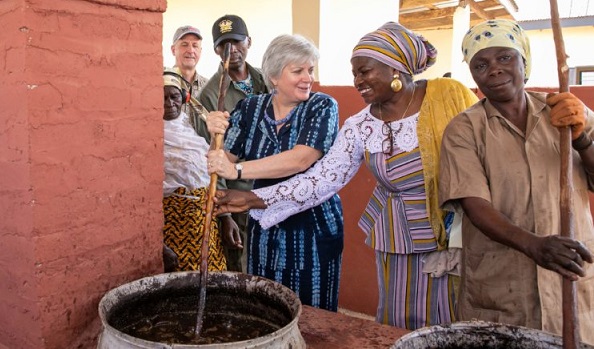 Ms Sullivan (third from right) processing shea butter