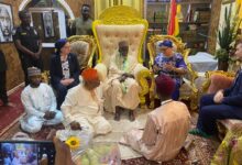 Chief Imam seated middle having discussions with Ms Sullivan