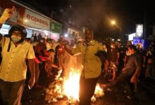 Protesters chanted slogans and burned signs on the roads at Thursday's demonstration