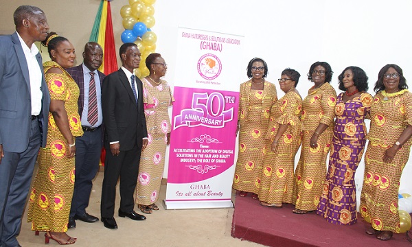 Mr Morgan Ayawine (fourth from left) with Mrs Tina Offei Yirenkyi (fifth from right) and other dignitaries after unvailing the GHABA logo Photo Victor A. Buxton
