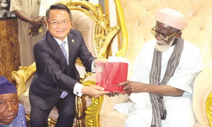 Ambassador, Lim Jung-Taek (left) presenting a gift to Chief Imam, Sheikh Osman Nuhu Sharubutu .Photo. Ebo Gorman