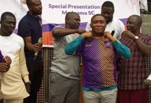 Mr Armah assist Mr Duker to wear a customized Medeama jersey after the presentation