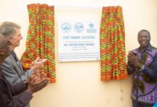 Inset, Mr Mohammed Amin (rithgt) with Mr Steven Marma unvailing the plaque on the facility