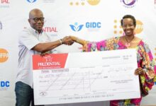 Mr Aryee, Regional CEO for Prudential West Africa (left) presenting the dummy cheque to Dr Agnes Kayitankore, Deputy Country Representative of United Nations Population Fund Ghana