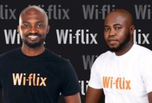 Mr Yeboah (right) with Louis Manu, another official of Wi-Flix at the launch of the partnership