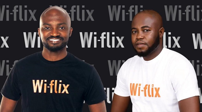 Mr Yeboah (right) with Louis Manu, another official of Wi-Flix at the launch of the partnership