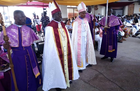 Bishop Bobby Harley-Neequaye(second from left) and Apostle John Stanley Clottey during the ordination.