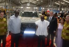 President Akufo Addo (third from left) and Mr Kyerematen(second from left) pose with officials of Japan Motors during the commissioning ceremony