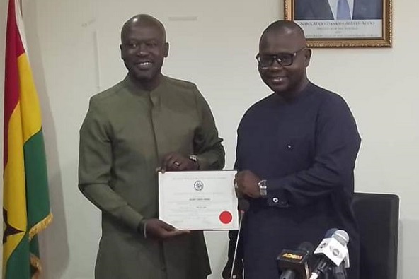 Sir Adjaye (left) receiving his membership certificate from Mr Asenso-Boakye during the induction ceremony