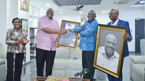 Mr Jeremaine Nkrumah(second from right) presenting the citation to Mr Henry Quartey. Photo. Vincent Dzatse