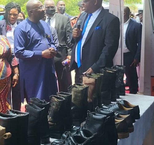 Dr Karl Laryea explaining to Vice President, Dr Mahammudu Bawumia about the shoes
