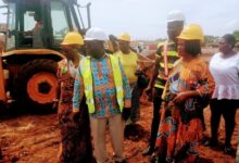 Mr. Albert Boakye Okyere (middle) and other members touring the project site