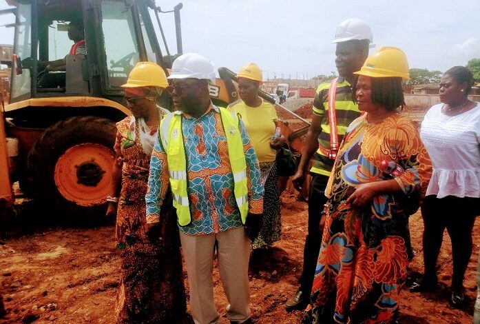 Mr. Albert Boakye Okyere (middle) and other members touring the project site