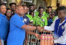 Chelsea captain Jackson Owusu (left) receiving the donation from Nana Gyimah on Friday