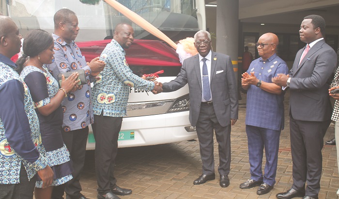 (inset)Mr Yaw Osafo Maafo(second from right) handing over the keys to Dr Dickson Tsey, while others look on. Photo Godwin Ofosu-Acheampong