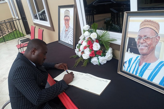 Liman Mohammed, a lawyer signing the late MP’s book of condolence