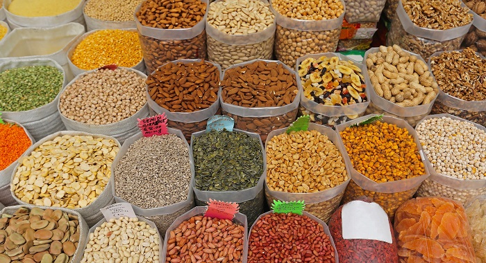 Dried fruits and nuts in bulk bags at market