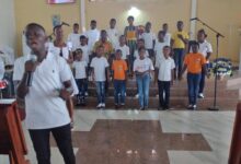 Sunday school children singing to entertain the congregation