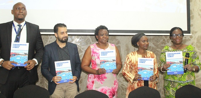 Madam Adelaide Anno-Kumi (right),Mr Nnamdi Iwuora (left),Ms Abibatou Wane-Fall (second from right) and other dignitaries launching the report. Photo. Ebo Gorman