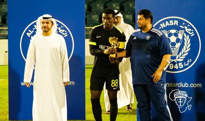 Mr. Al-Daleel (right) presenting the goalkeeper of the tournament trophy at the championship