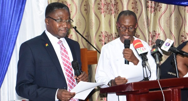 Prof Robert Kingsford Adaboh (left) swearing Prof. Bosu into office