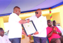 President Nana Addo Dankwa Akufo-Addo (right) presenting a plaque to Mr Sowah
