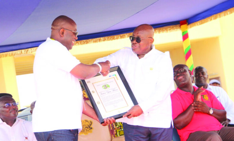 President Nana Addo Dankwa Akufo-Addo (right) presenting a plaque to Mr Sowah