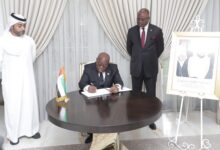 President Akufo-Addo signing the book of condolence in honor of Sheikh Khalifa Bin Nahyan, President of UAE With them are Mr Amer Al Alawi (left), Charge d'Affairs and Mr Am