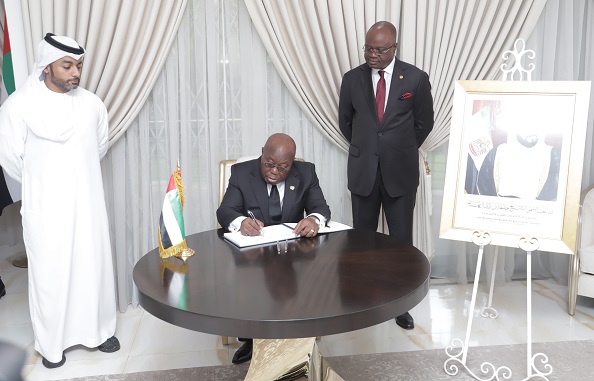 President Akufo-Addo signing the book of condolence in honor of Sheikh Khalifa Bin Nahyan, President of UAE With them are Mr Amer Al Alawi (left), Charge d'Affairs and Mr Am