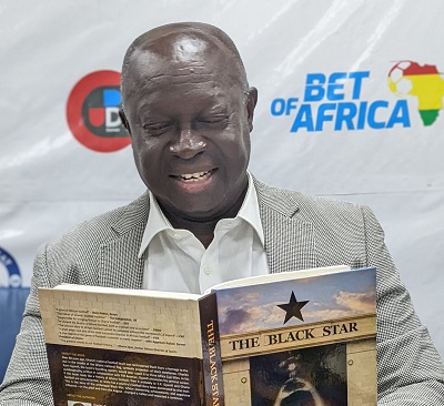 Sports-Writers-Association-of-Ghana-SWAG-President-Kwabena-Yeboah-with-a-copy-of-the-book