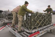 • Ukrainian servicemen unpack an earlier shipment of US military aid at Boryspil airport outside Kyiv, Ukraine