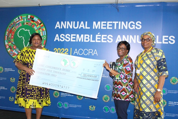 • Mrs Grace Adesina (second from right) presenting the dummy cheque to Madam Yvonne Norman (left), deputy director,Osu Children Home. Looking on is Ms Nwabufo Nenna, D-G, East of Africa Afdb. Photo: Ebo Gorman