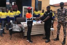 District Police Commander, Paul Ankah (right) receiving the items from Mr Aboagye
