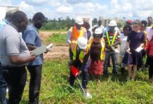 • -Dr Donkor cutting sod for works to starta