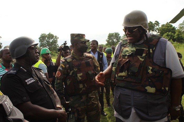 Inset; Mr Henry Quartey (right) having a chat with the security personnel during the exercise.Photo. Ebo Gorman