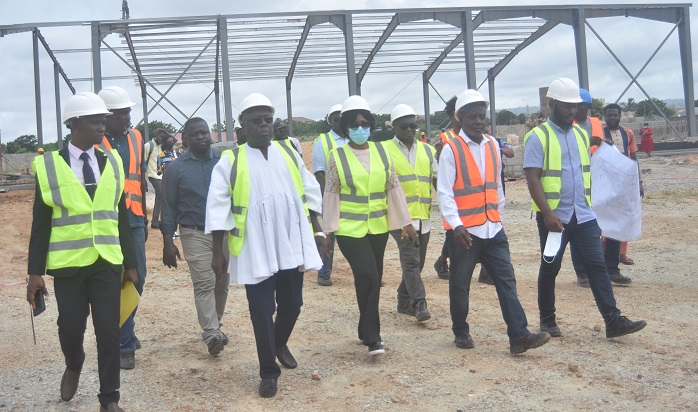 Dr Kwaku Afriyie (second from left) and his entourage touring the E-waste project site. Photo - Michael Ayeh