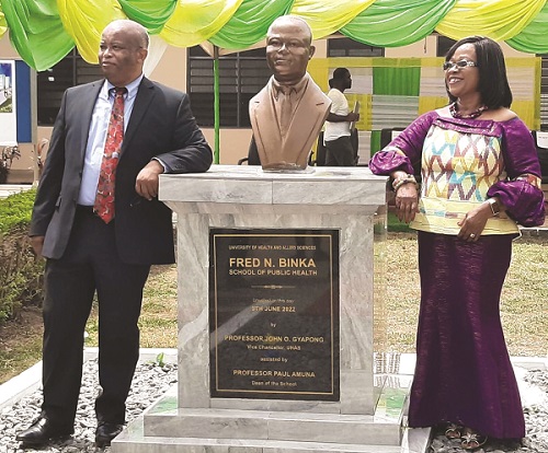 • Prof Binka and wife Charity standing by the bust unveiled in his honour