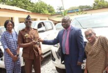 Prof. Samuel K. Annim (second from right) presenting the keys to the vehicle to Supt. Abdul Rahman Issaka(second from left),Dep.Chief Criminal Records Officer,Prisons.With them are officials from GSS.Photo.Ebo Gorman