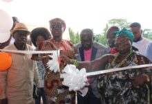 Nana Akosua Asor Brayie, Queen of Sunyani and Bono Regional Minister cutting the tape..looking on is Kwame Osei-Prempeh, CEO of GOIL