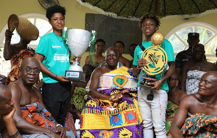 Grace Acheampong and Mavis Owusu with the trophy as the Asantehene look on